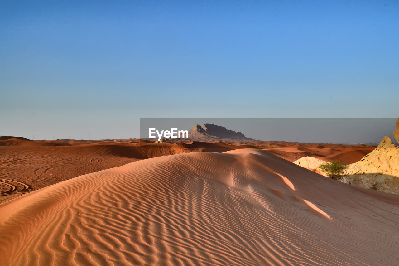 Scenic view of desert against clear sky
