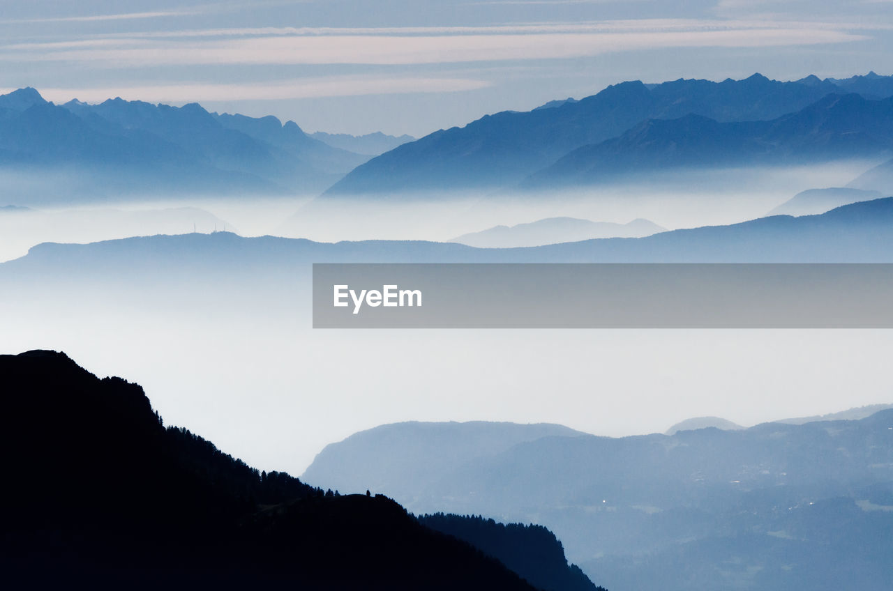 Scenic view of silhouette mountains against sky