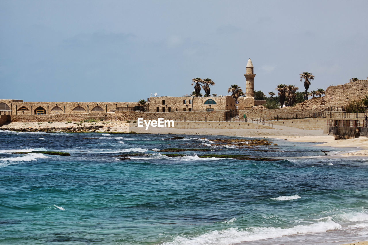 Sea by caesarea maritima against sky