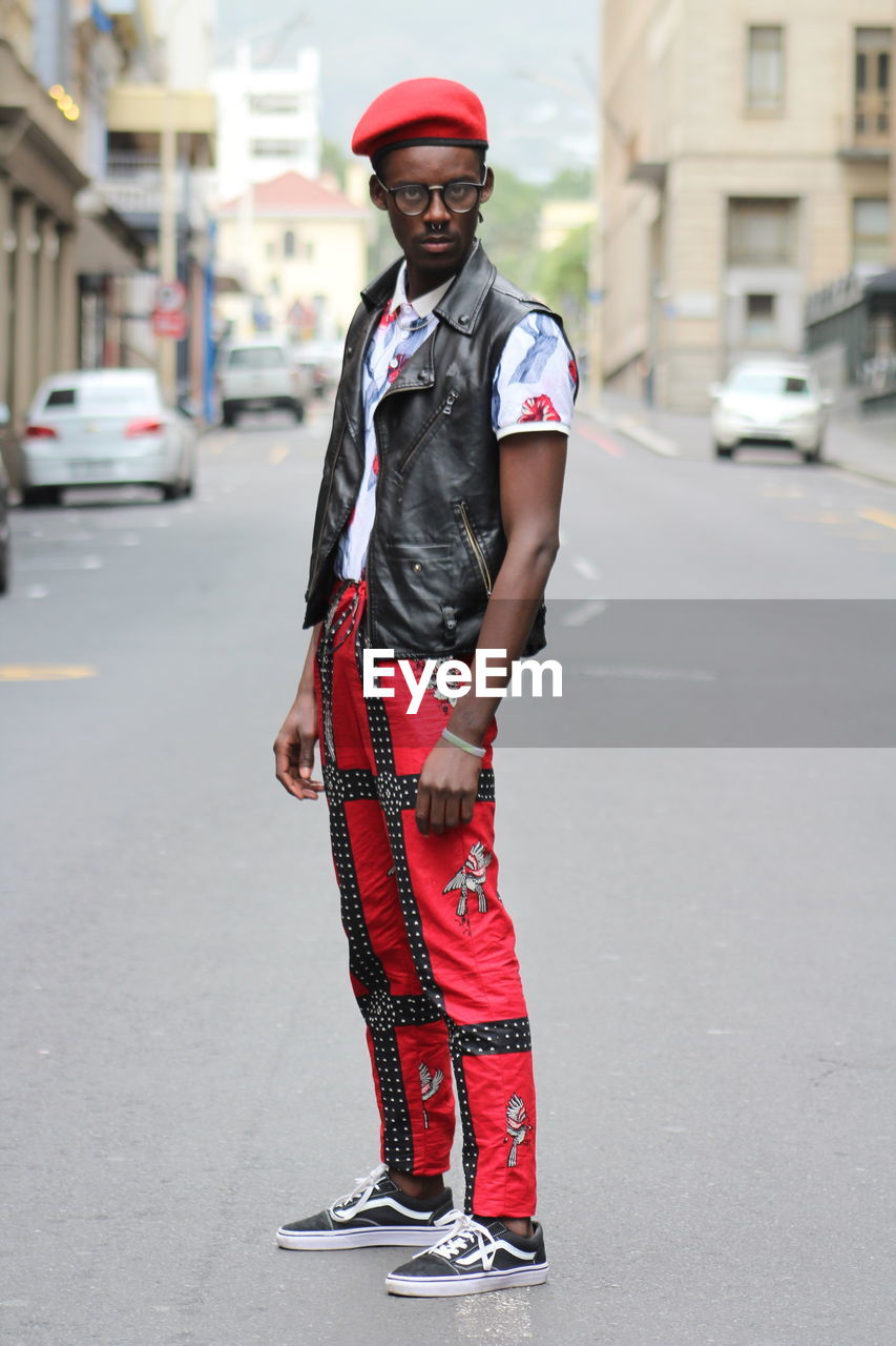 PORTRAIT OF MAN STANDING ON STREET