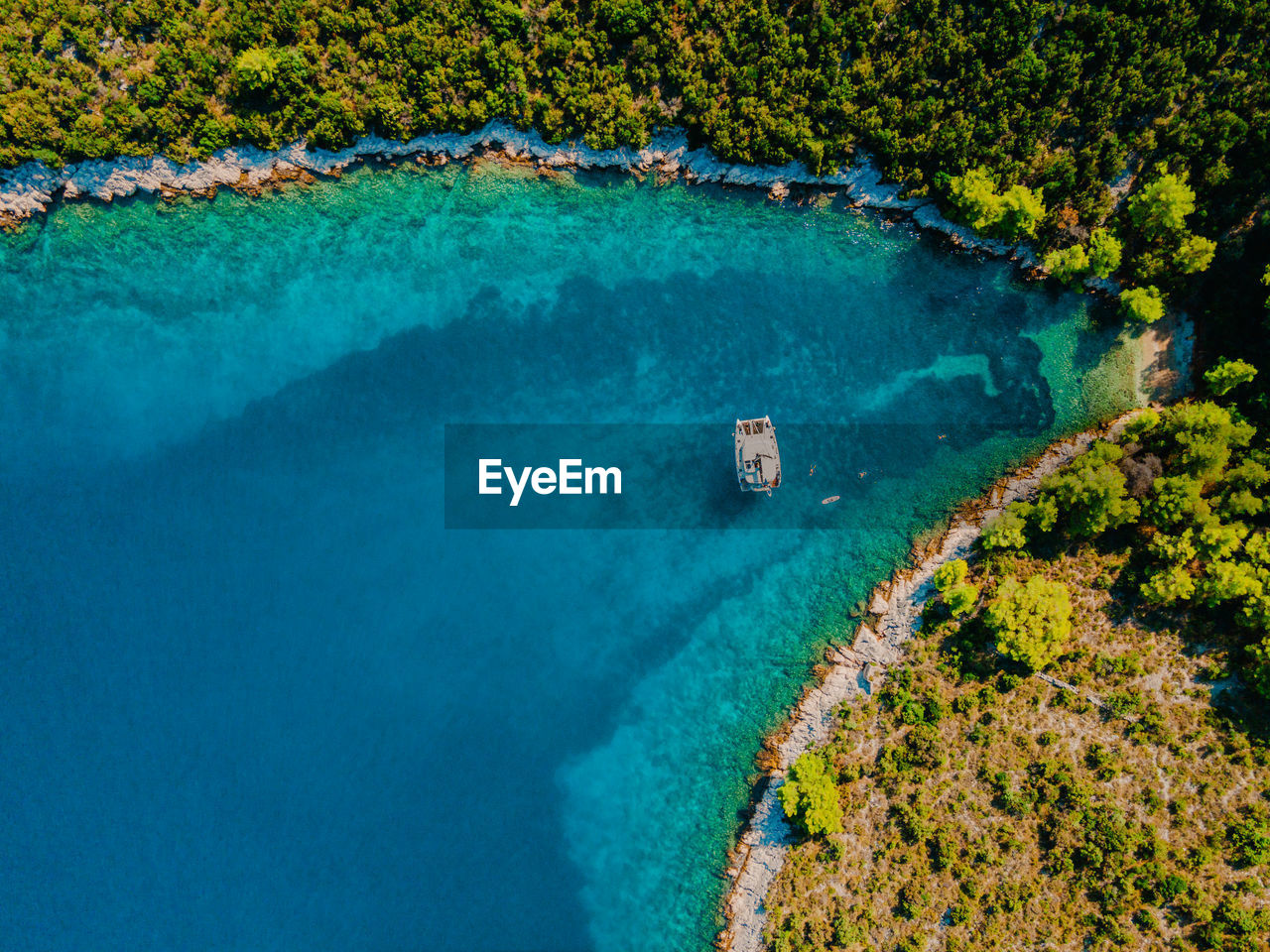 Sailing yacht catamaran anchored in a remote beautiful bay in croatia.