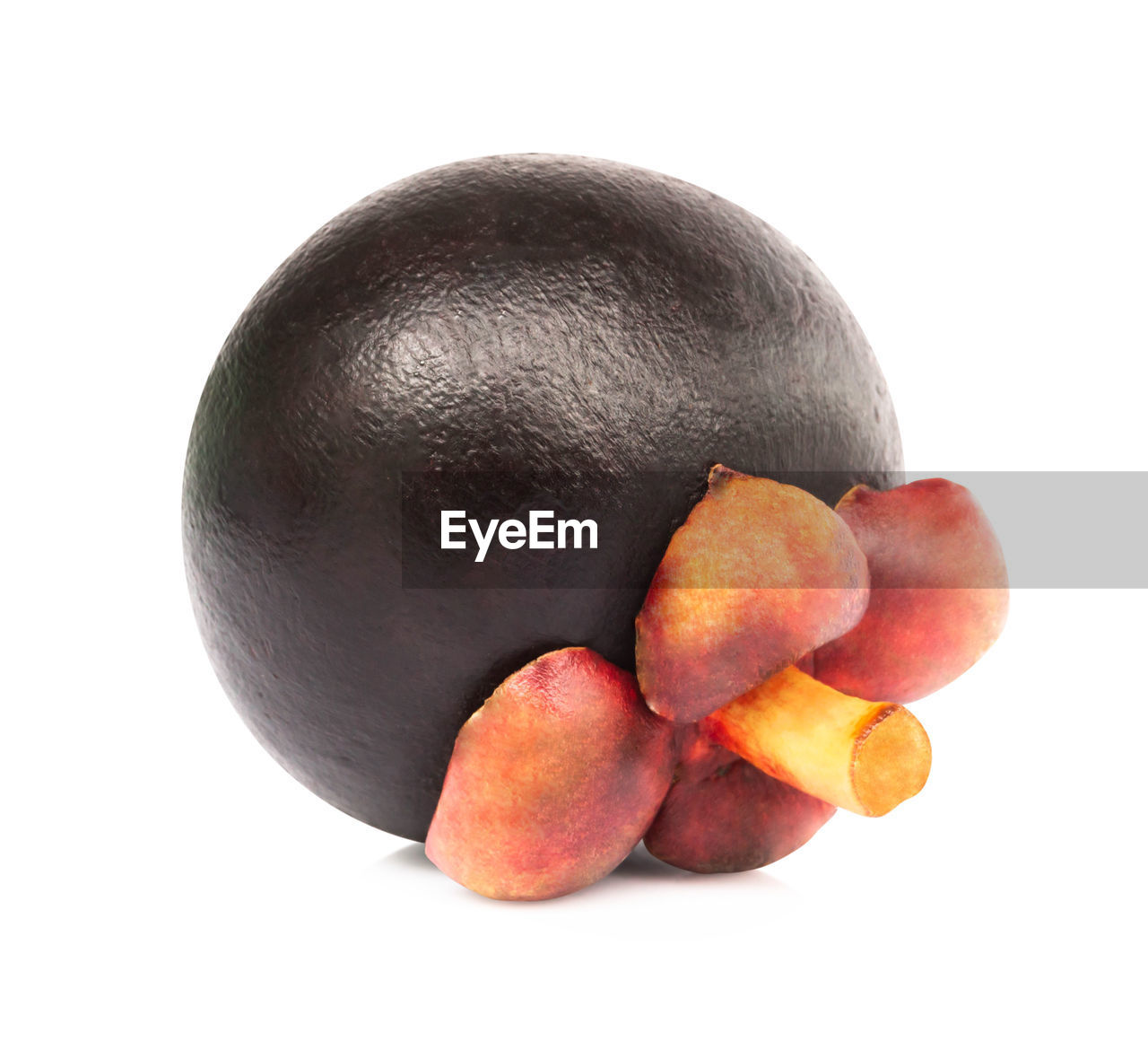 Close-up of mangosteen against white background