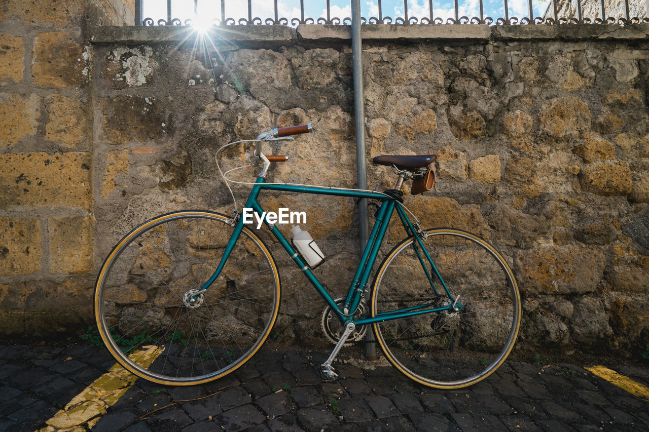 Vintage bicycle against a wall.