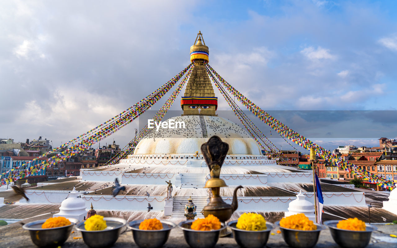 low angle view of temple against cloudy sky