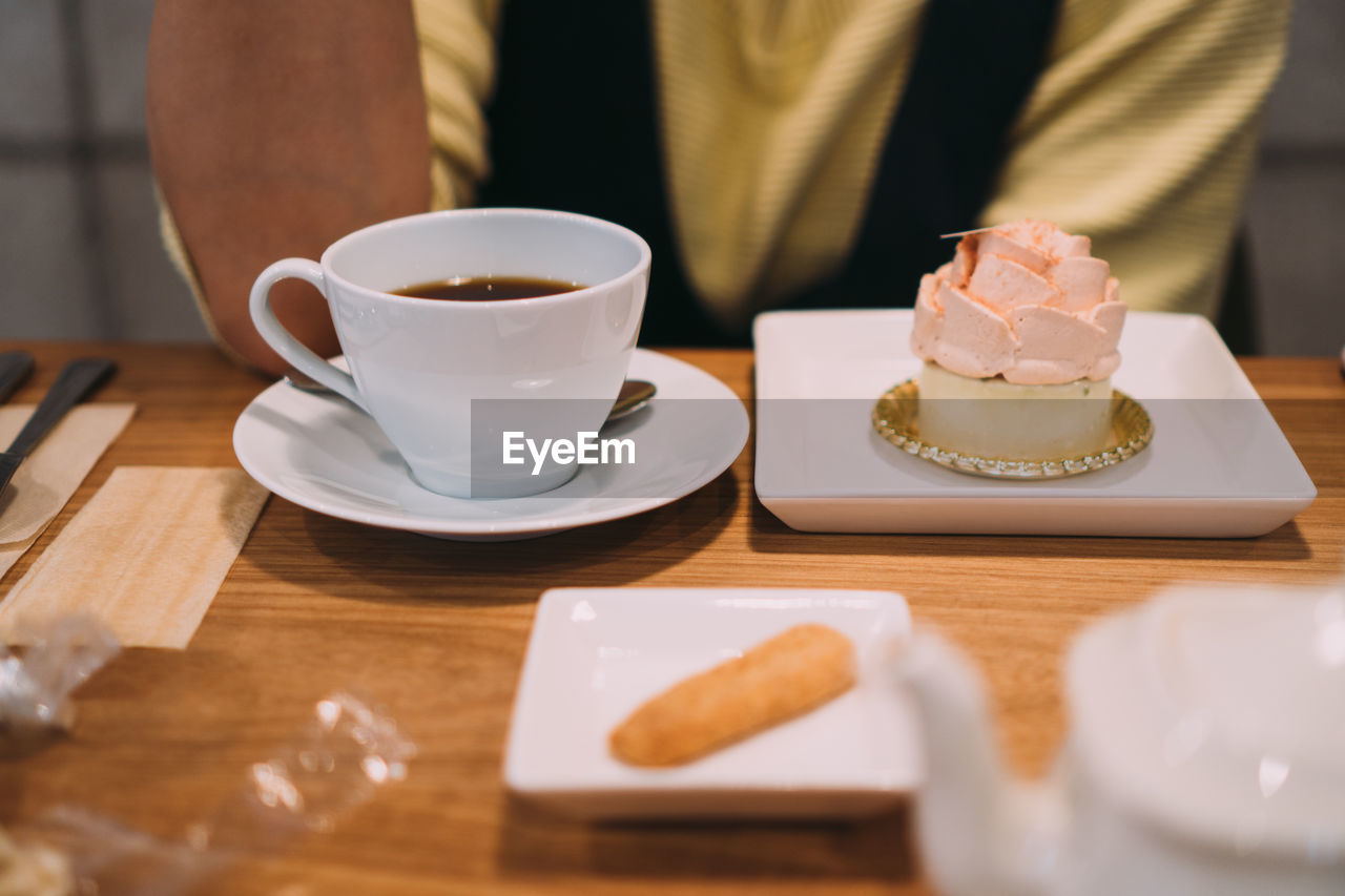 COFFEE CUP ON TABLE