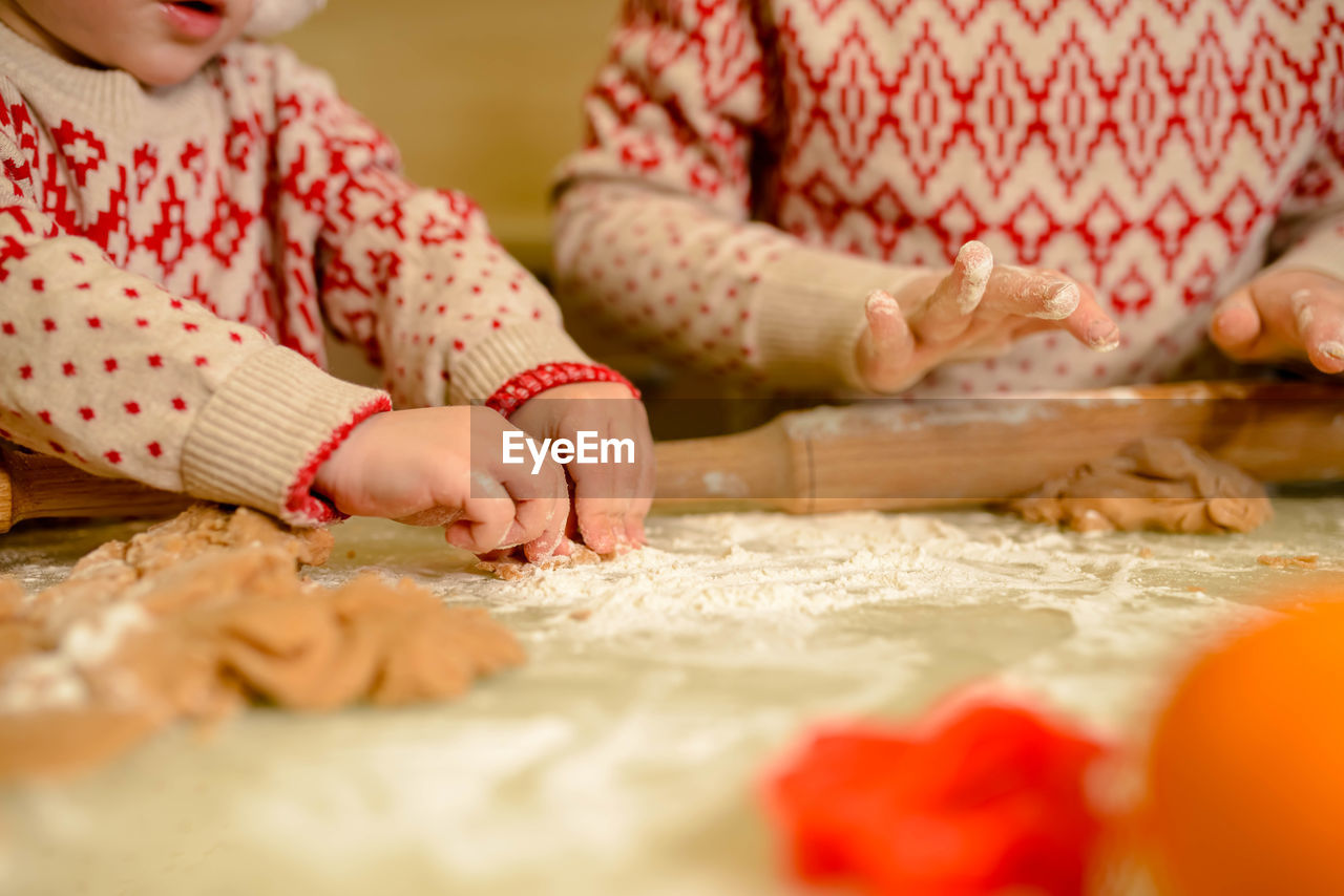 portrait of cute baby girl playing with toy blocks at home