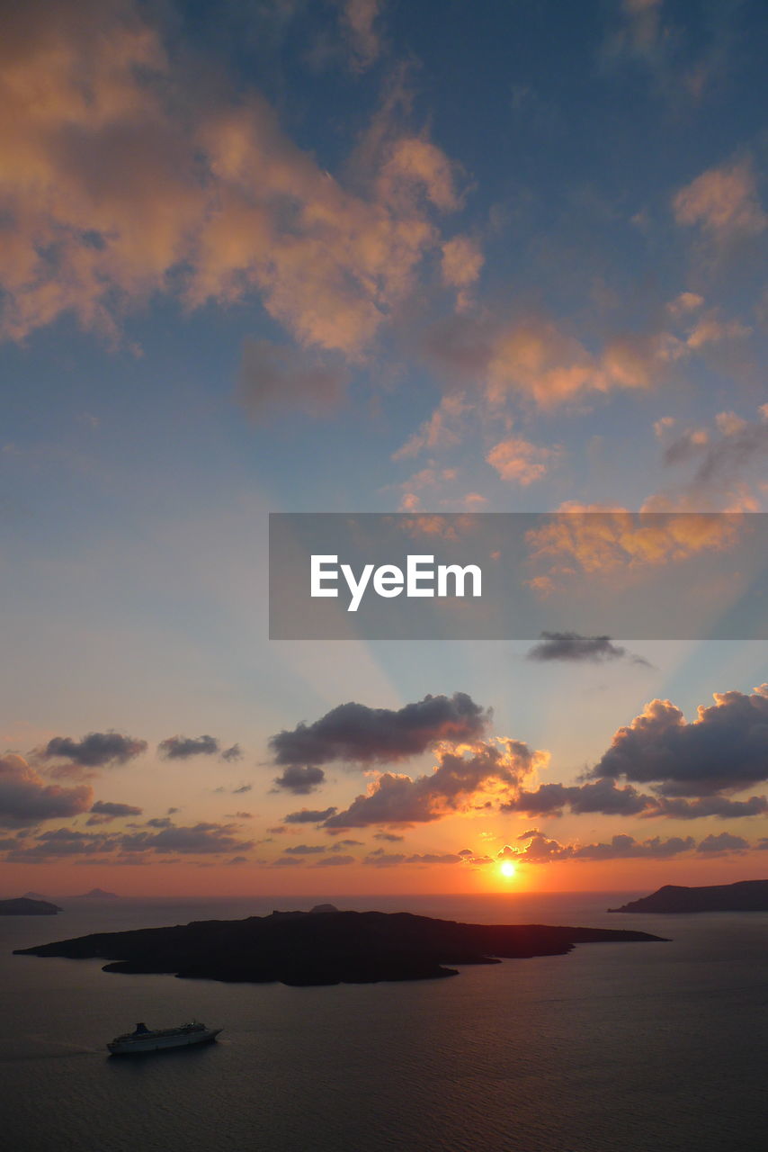 SCENIC VIEW OF SUNSET OVER SEA
