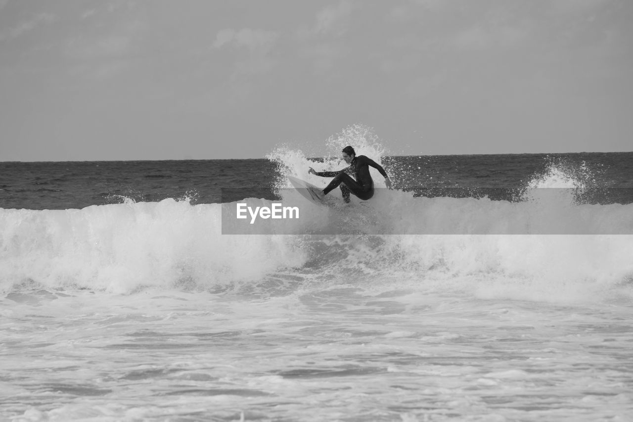 Man surfing on sea