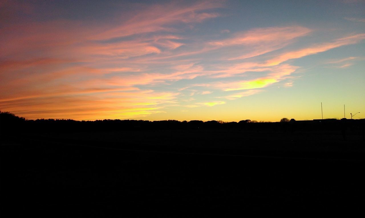 Silhouette of landscape against sunset sky