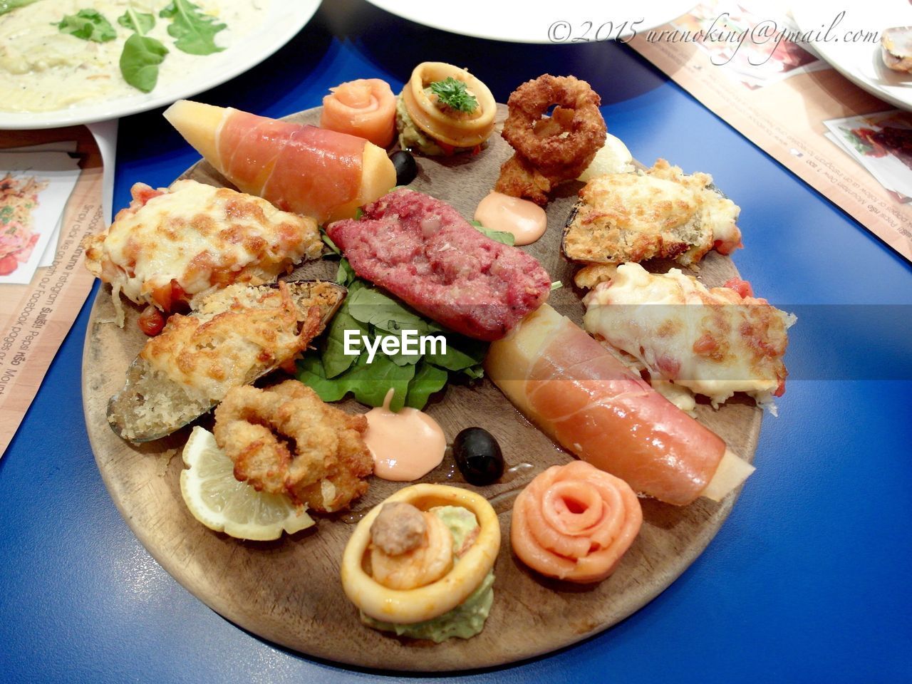 High angle view of seafood appetizers served in plate on table