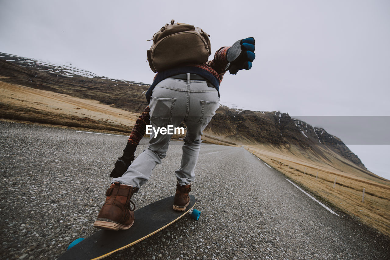 Man skateboarding on highway