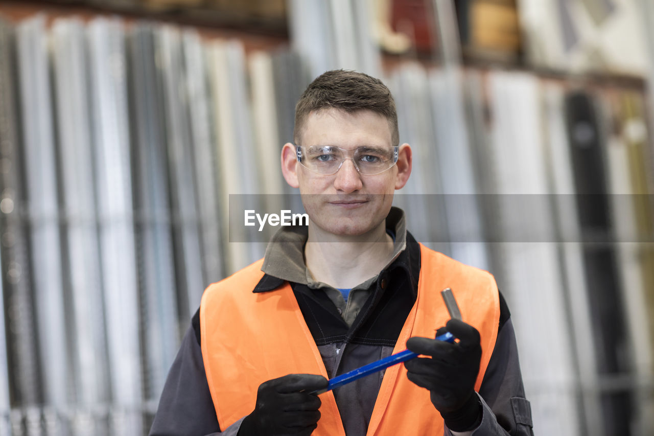 Technician male with a tool working in a store