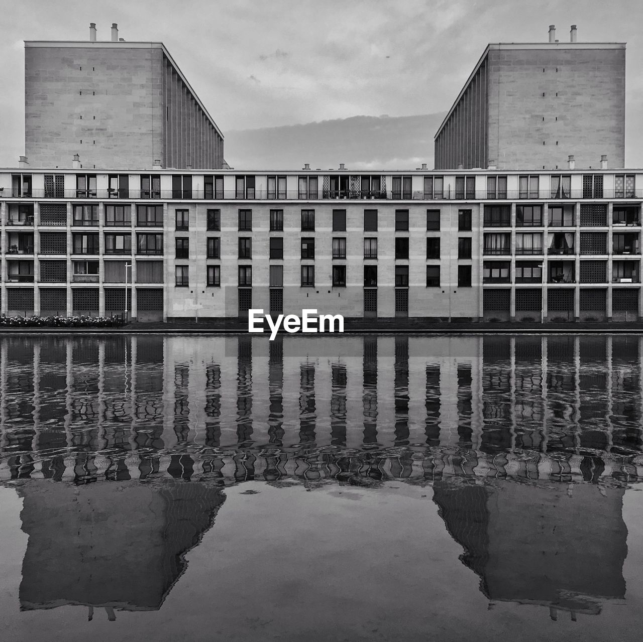 REFLECTION OF BUILDING IN LAKE