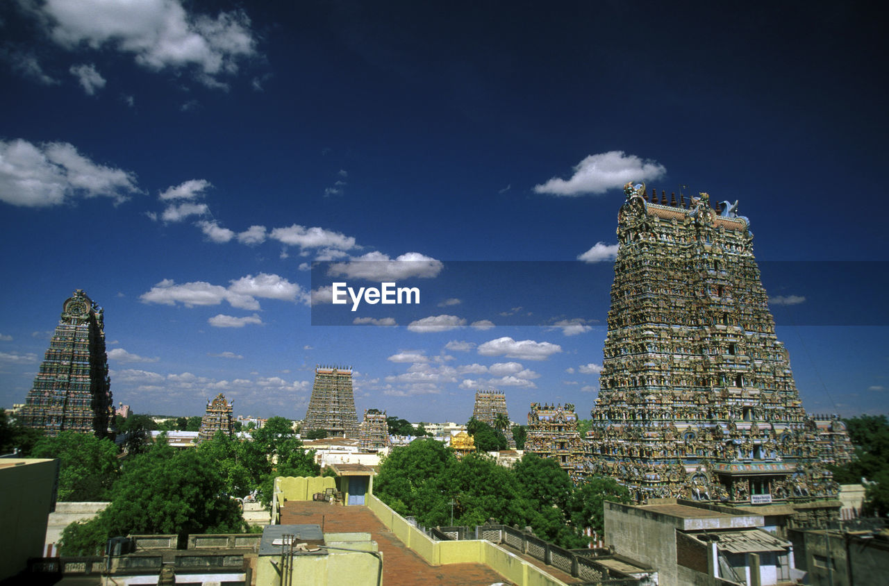 Meenakshi amman temple with cityscape against sky