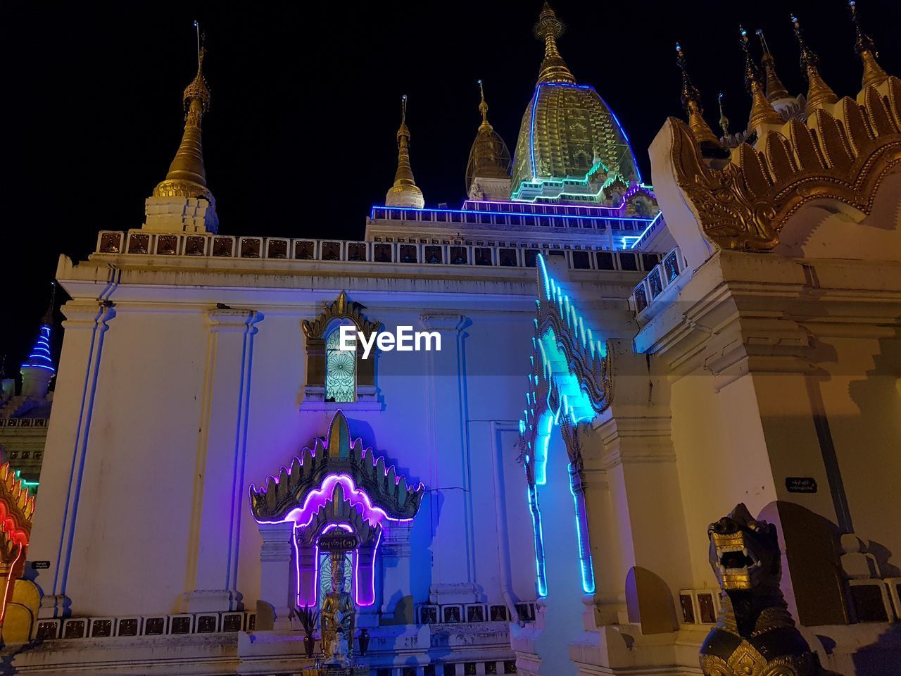 LOW ANGLE VIEW OF ILLUMINATED CATHEDRAL