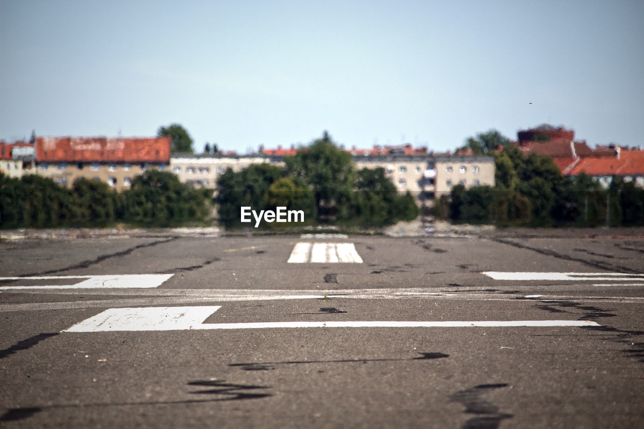 ROAD SIGN AGAINST CLEAR SKY