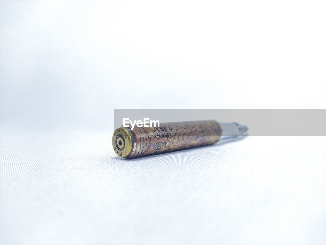 CLOSE-UP OF CIGARETTE ON TABLE