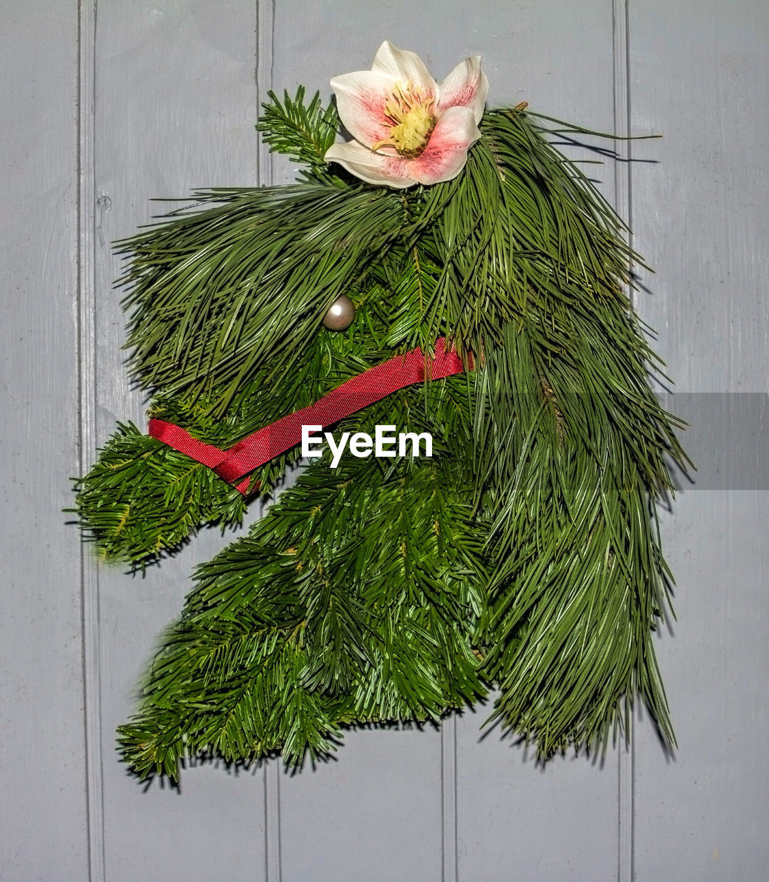 Close-up of christmas decoration hanging on wooden wall