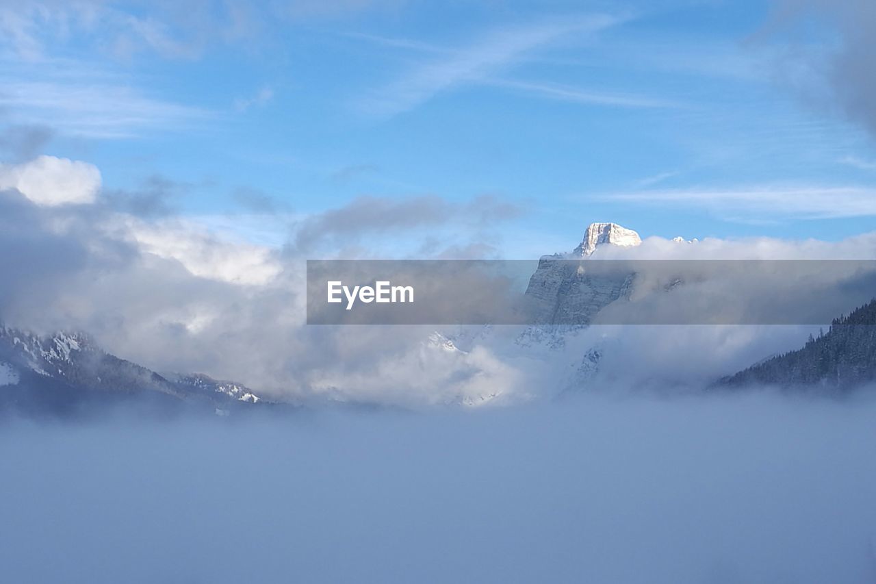 Scenic view of snow in mountains against sky