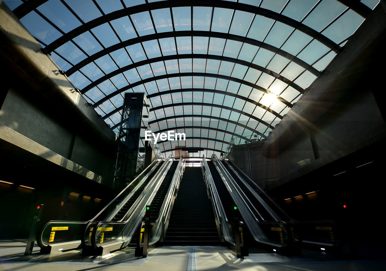 View of escalator against ceiling