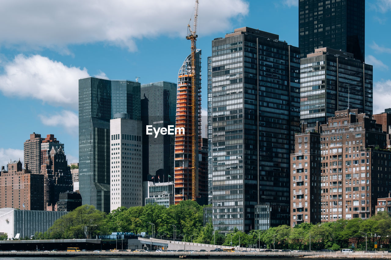 Modern buildings in city against sky