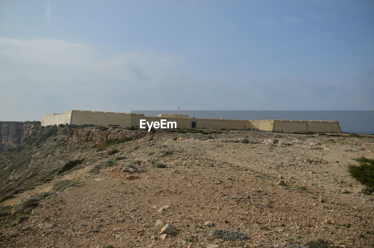 Low angle view of sagres fortress against sky