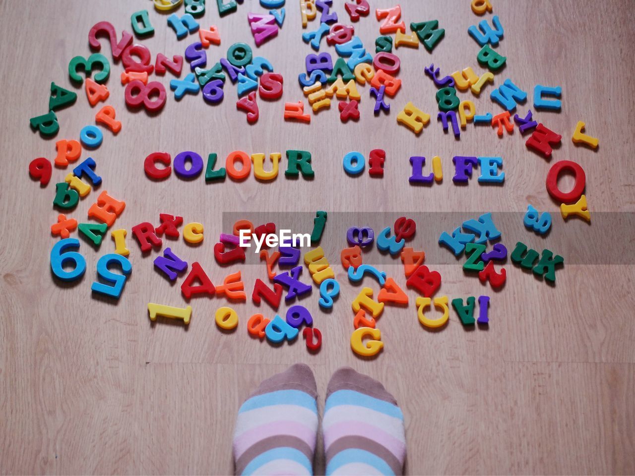 Close-up of colorful letters scattered on floor