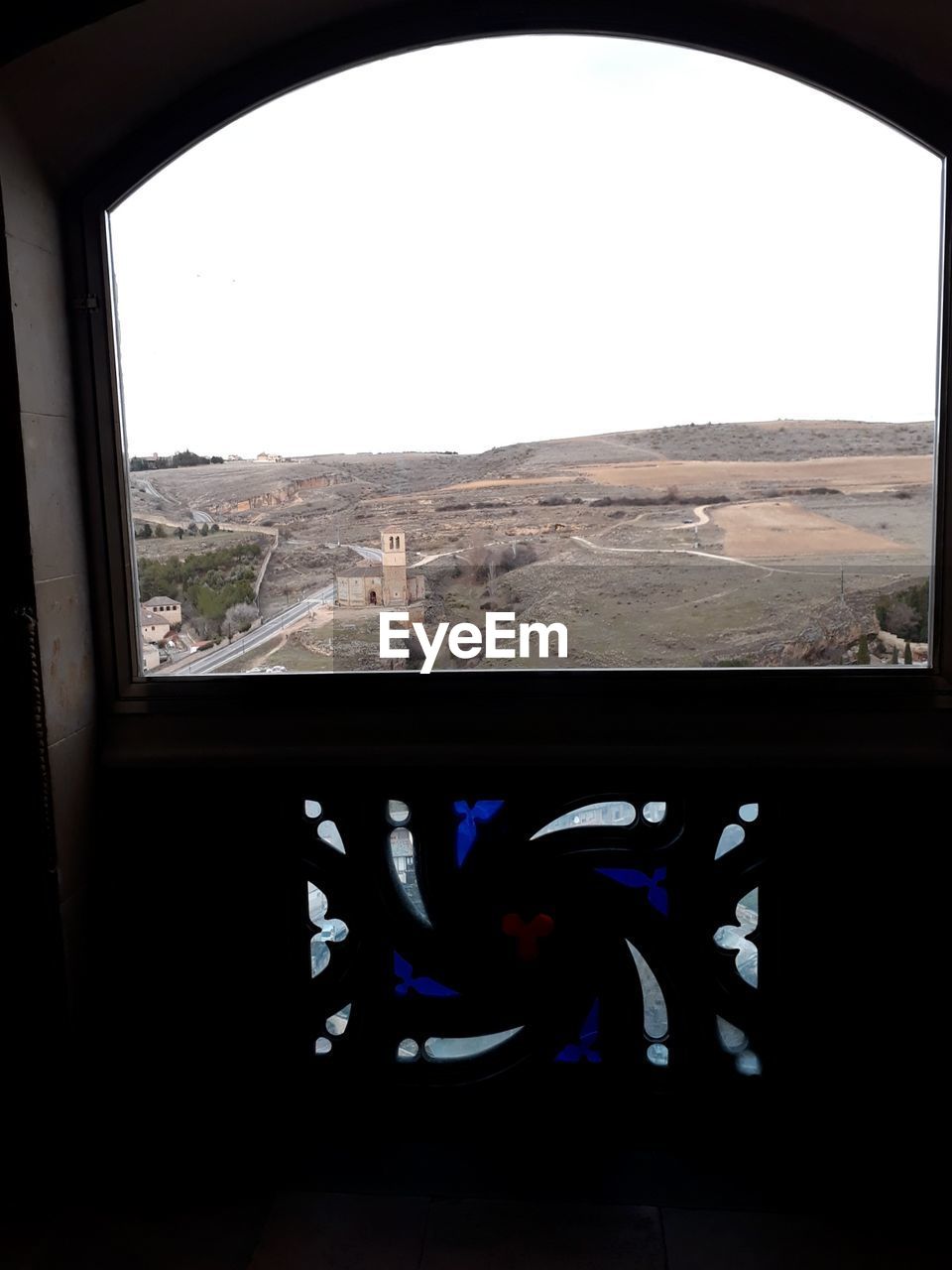 LANDSCAPE SEEN THROUGH CAR WINDOW