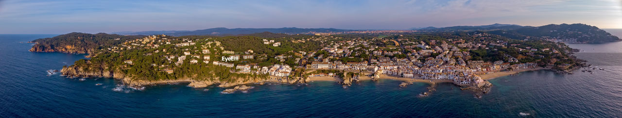 Panoramic view of sea and buildings in city