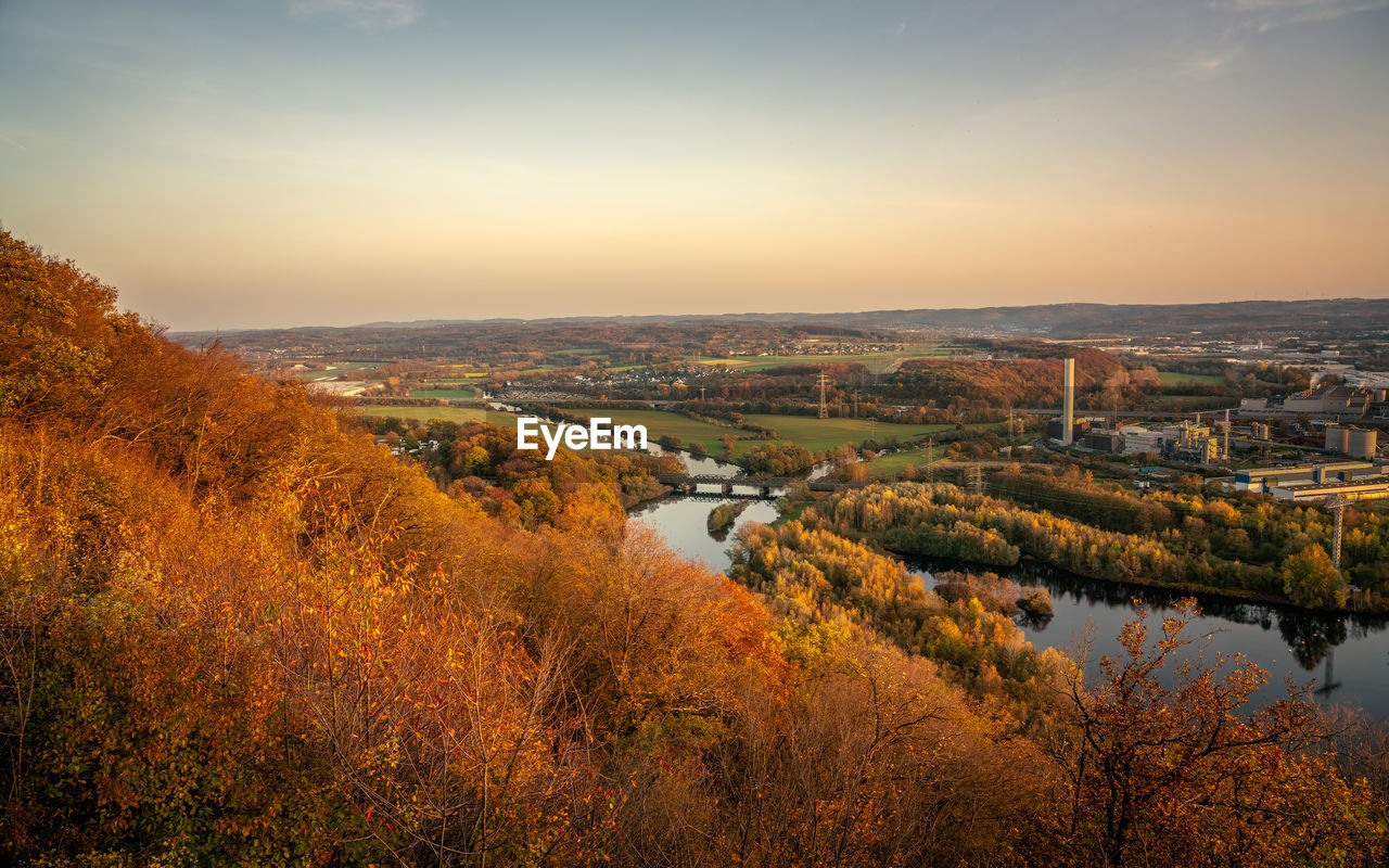 Scenic view of river against sky during autumn