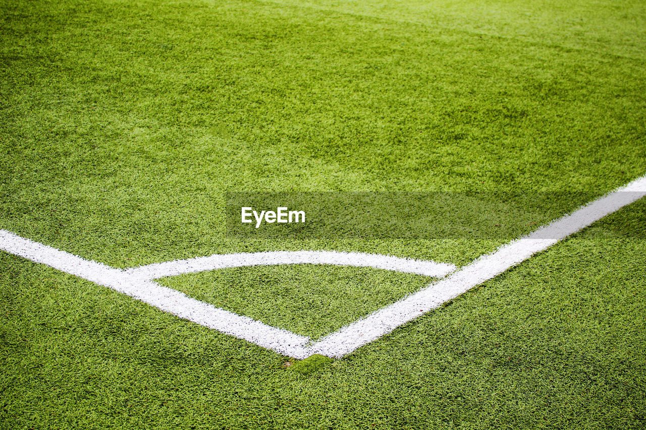 CLOSE-UP OF SOCCER FIELD AND GREEN GRASS