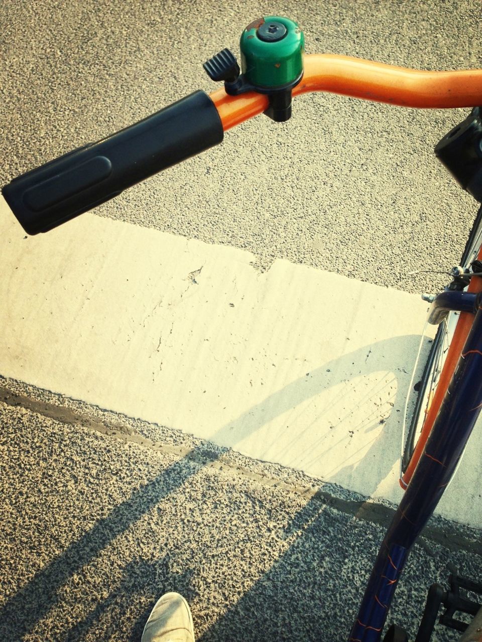 Cropped image of bicycle on street
