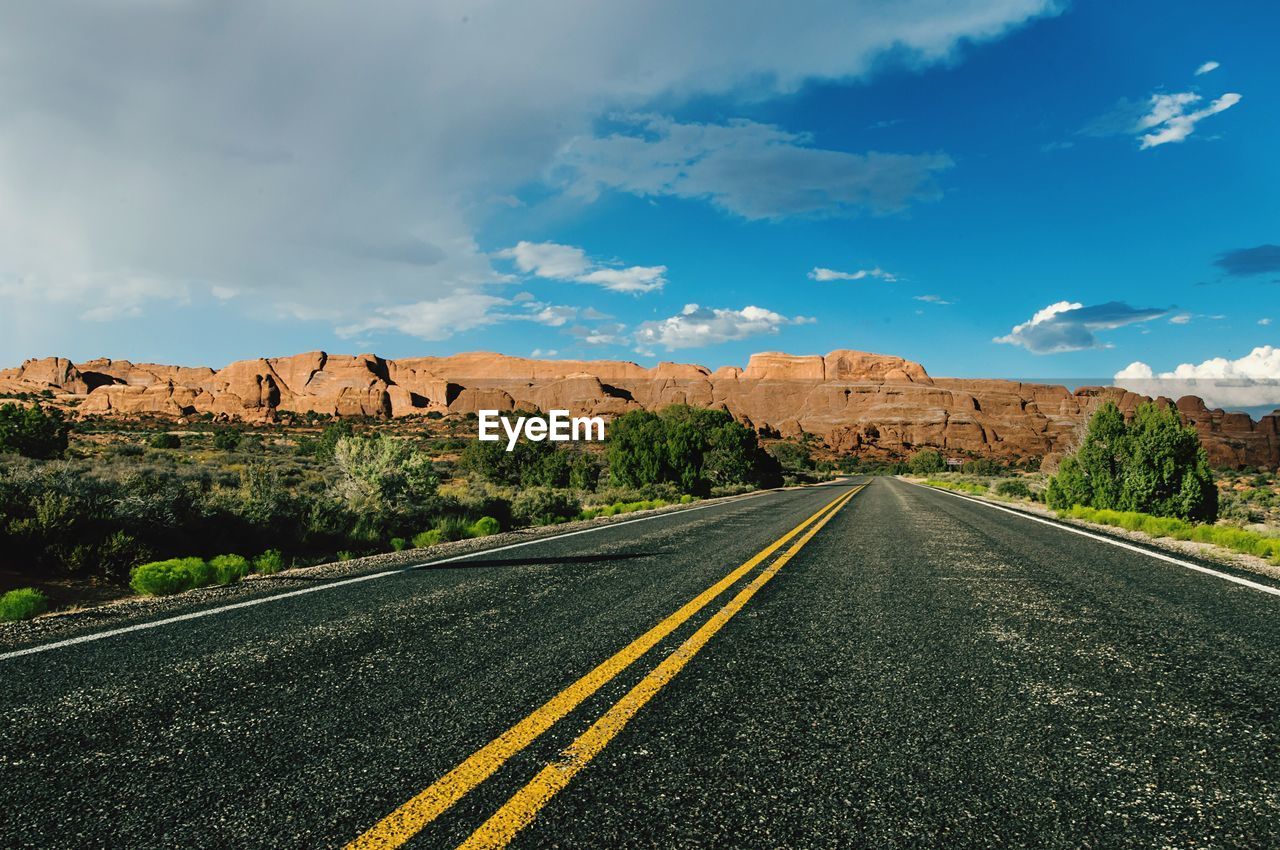 Empty road leading towards red rock canyon national conservation area