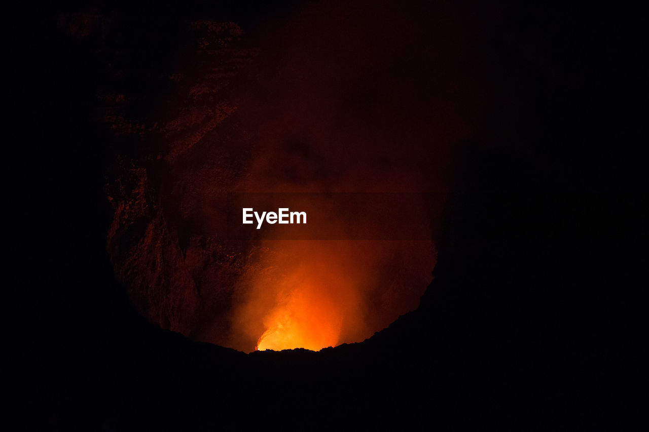 SCENIC VIEW OF ILLUMINATED MOUNTAIN AGAINST SKY