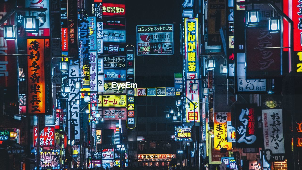 MULTI COLORED ILLUMINATED SIGN AT NIGHT