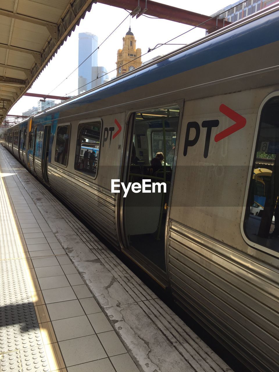 TRAIN AT RAILROAD STATION PLATFORM