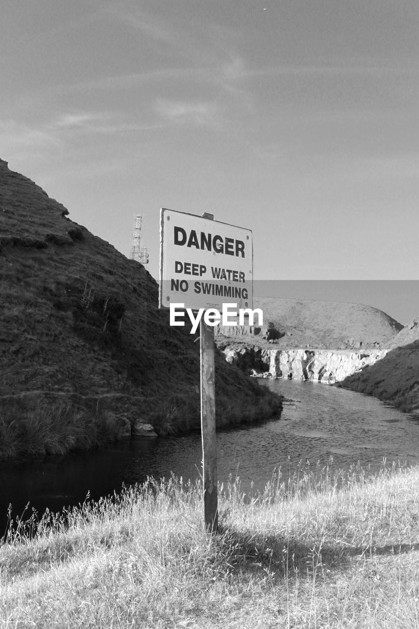 Information sign against clear sky