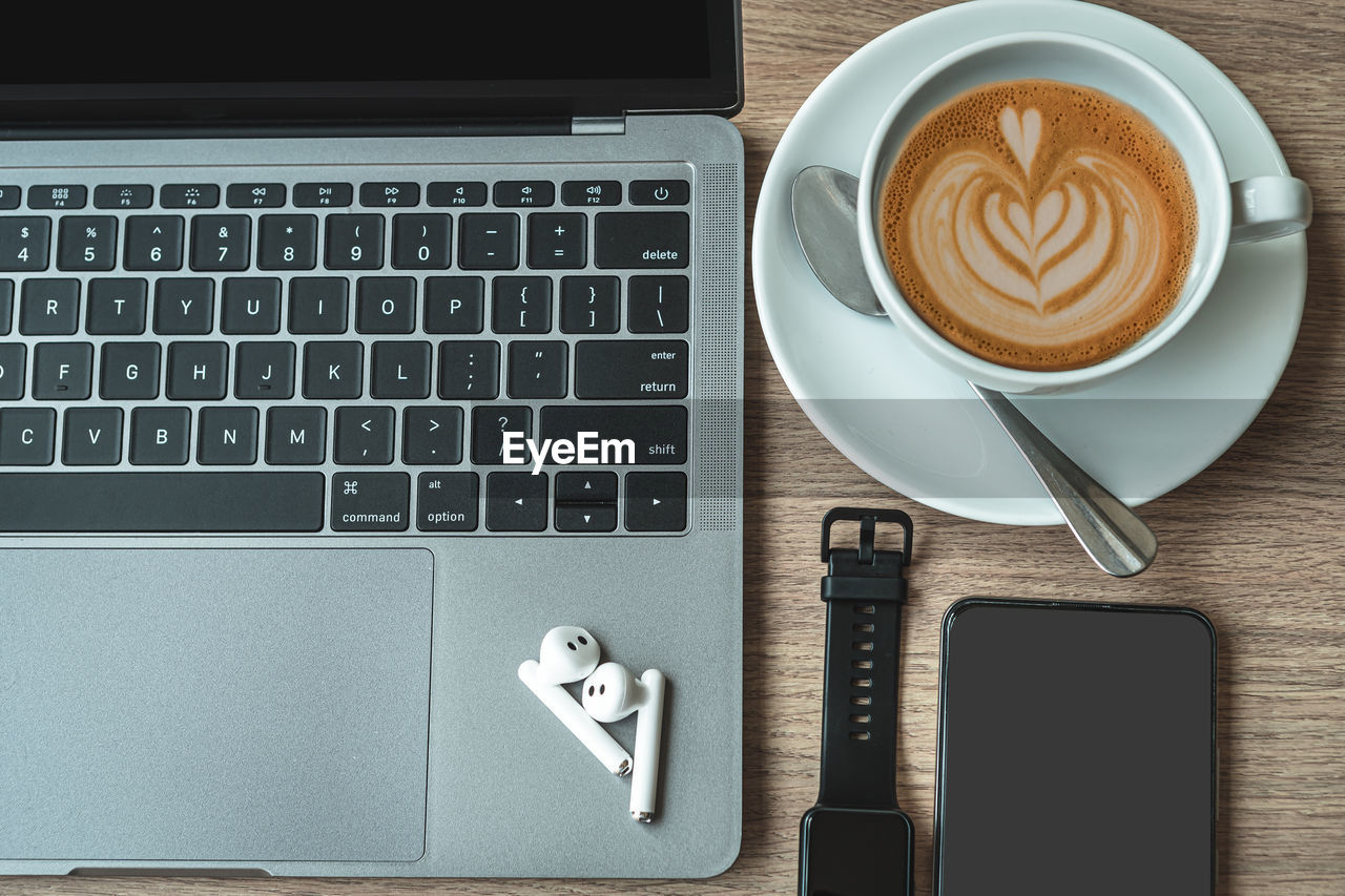 COFFEE CUP ON TABLE AT HOME