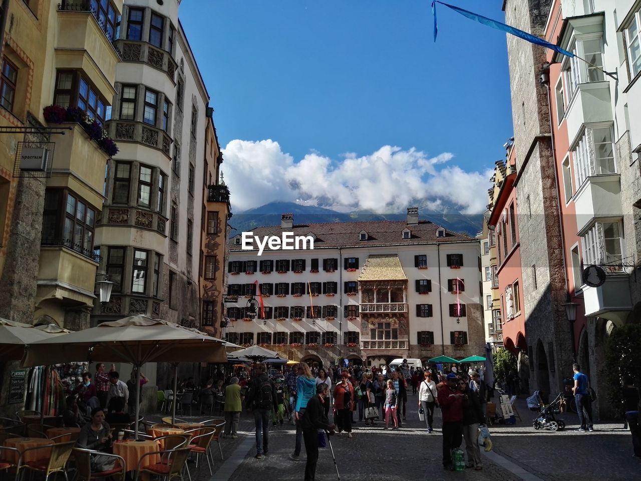 Crowd on street amidst buildings