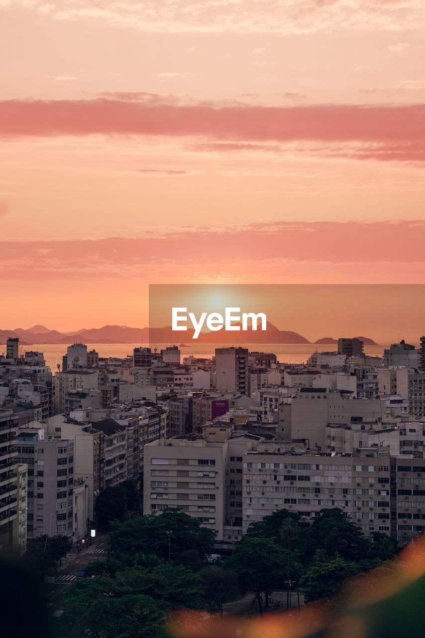 high angle view of cityscape against sky during sunset
