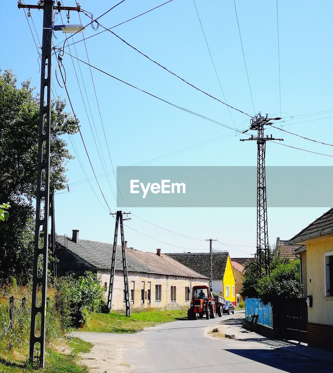 ELECTRICITY PYLONS AGAINST CLEAR BLUE SKY