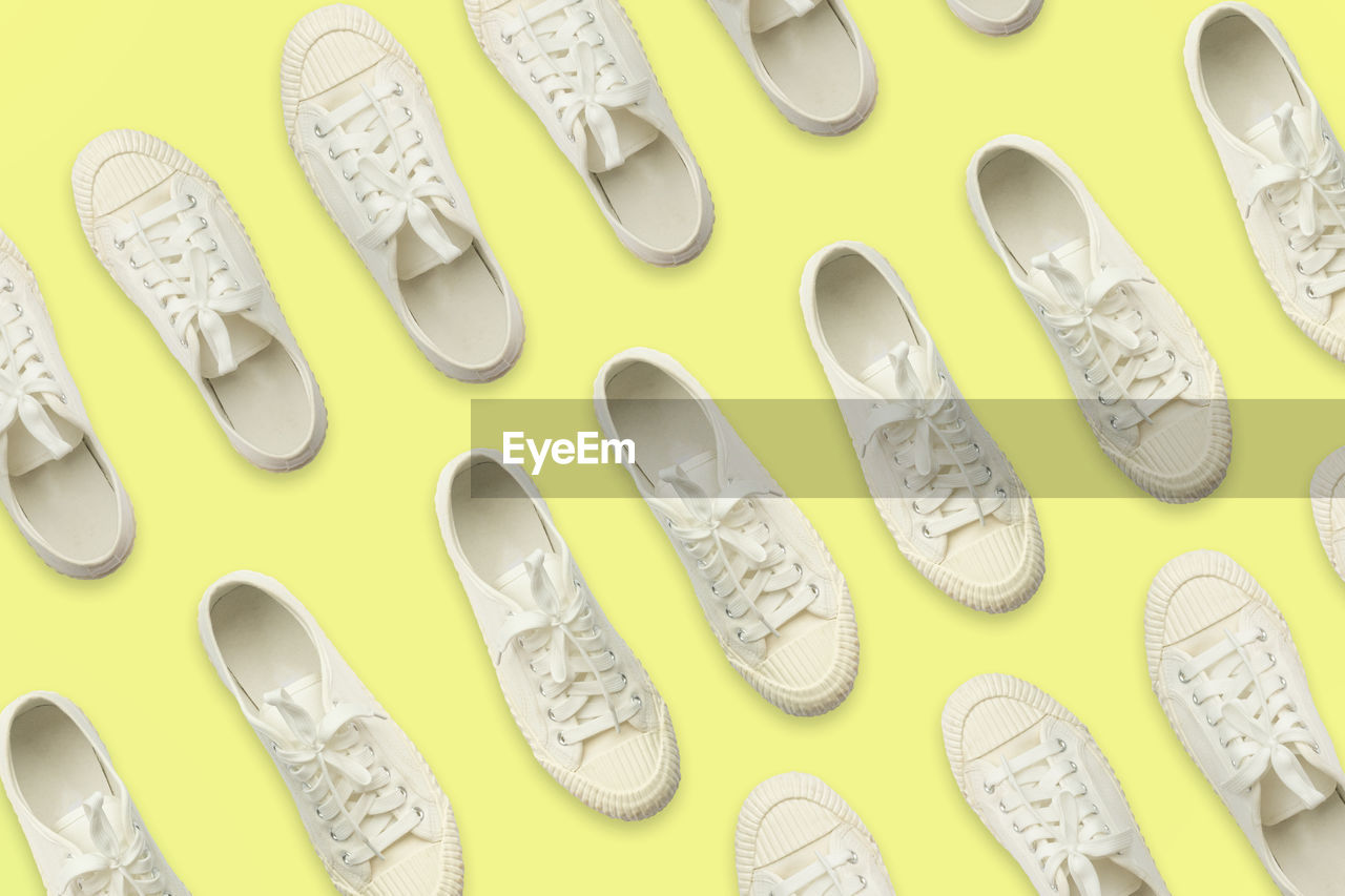 footwear, shoe, white, no people, large group of objects, indoors, in a row, yellow, order