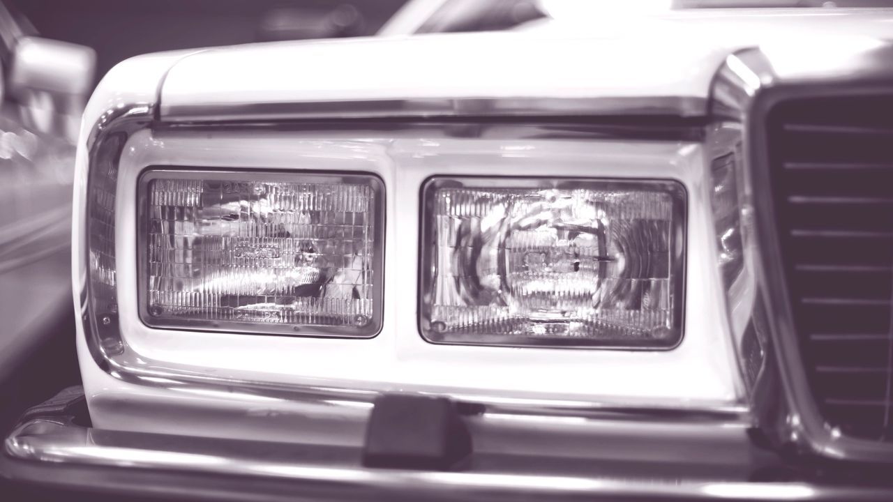 CLOSE-UP OF TRAIN ON ROAD