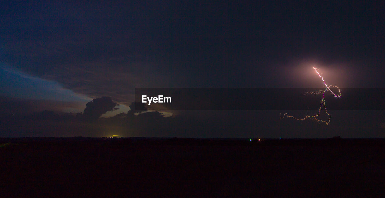 lightning, night, sky, forked lightning, thunderstorm, silhouette, illuminated, scenics, nature, dramatic sky, cloud - sky, beauty in nature, power in nature, outdoors, storm, storm cloud, no people, landscape, sunset