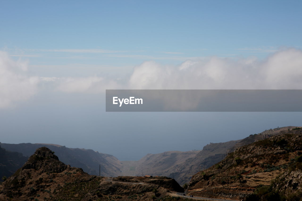 Low angle view of mountain range against sky