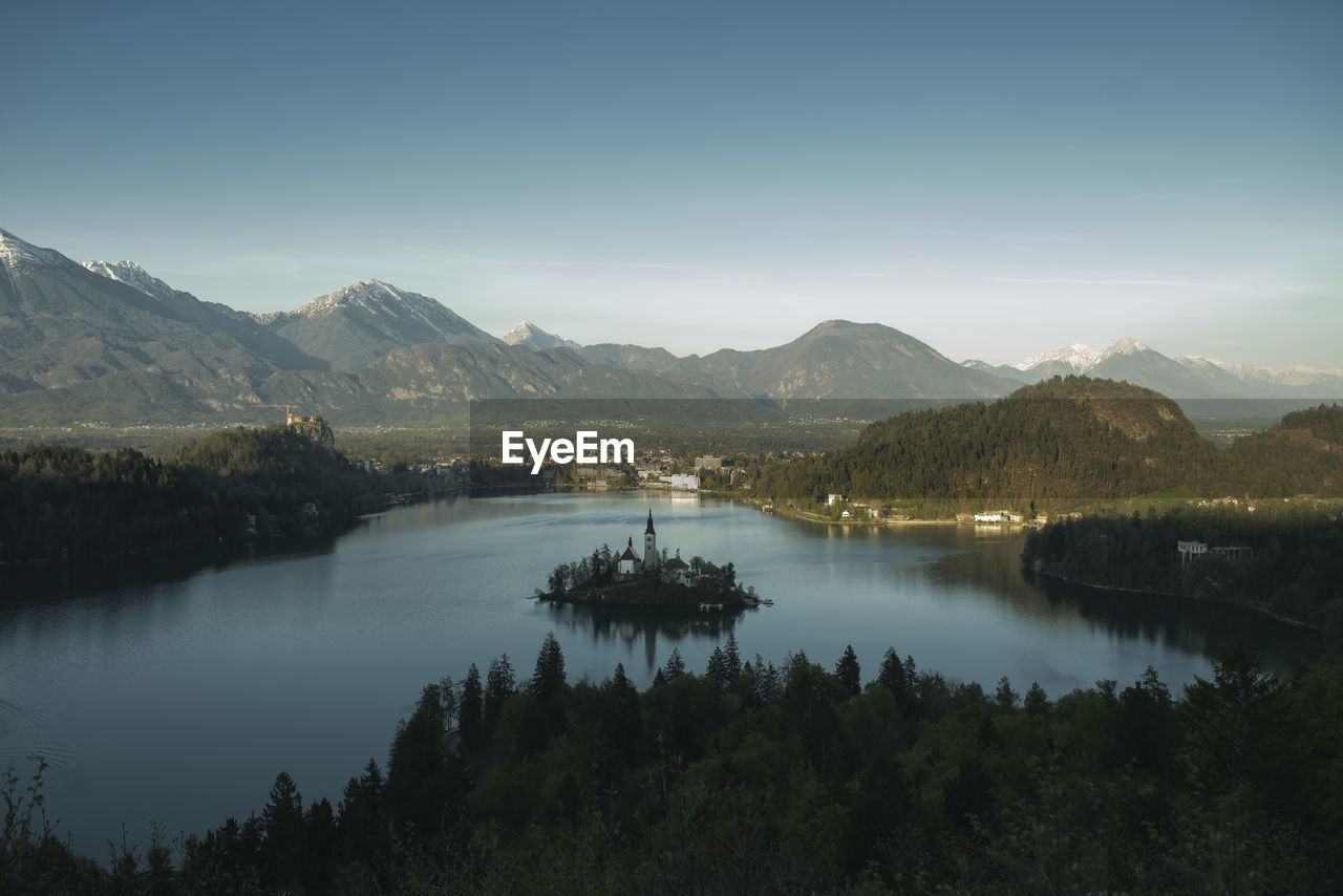 Scenic view of lake and mountains against sky