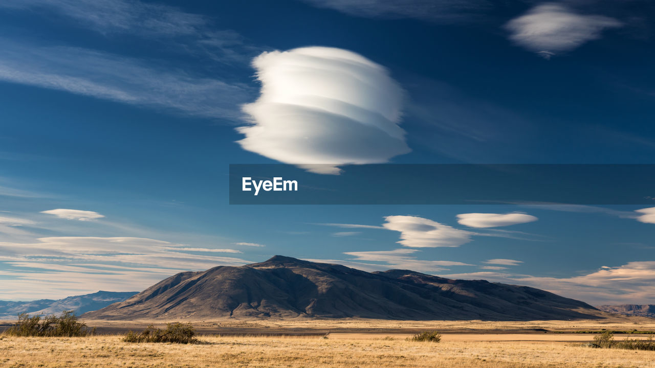 View of landscape against cloudy sky