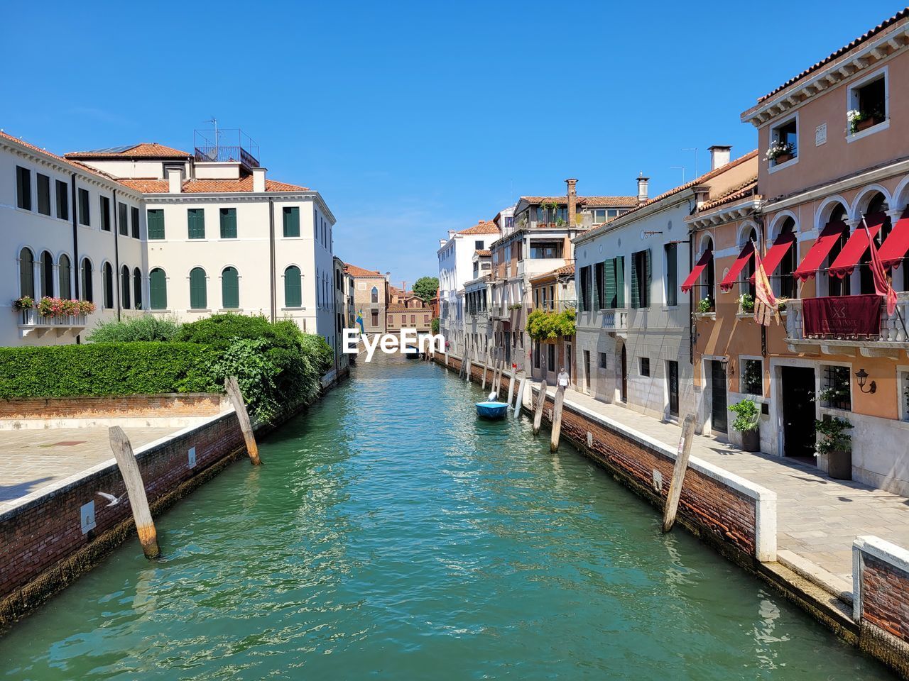 architecture, water, building exterior, built structure, canal, travel destinations, nautical vessel, nature, body of water, city, travel, tourism, sky, town, building, waterway, vacation, transportation, gondola, clear sky, channel, residential district, blue, waterfront, bridge, mode of transportation, trip, holiday, sunny, sea, day, outdoors, house, multi colored, no people, sunlight, vehicle, idyllic, lagoon, land, boat, tranquility, beauty in nature