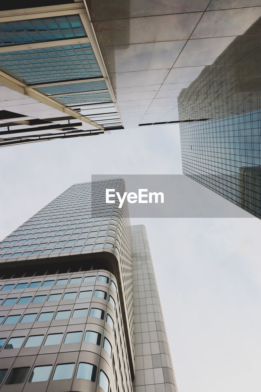 Low angle view of modern buildings against sky