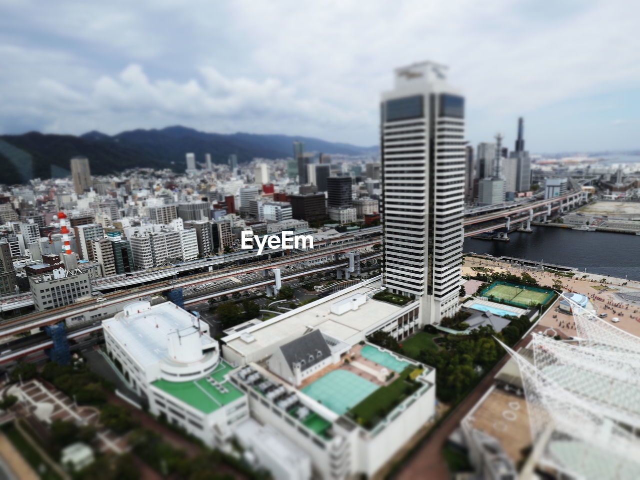 HIGH ANGLE VIEW OF MODERN BUILDINGS AGAINST SKY